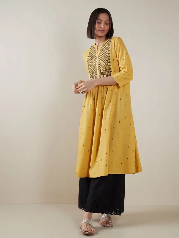 Cuffed Women Shorts for a Laid - Back and Trendy LookUtsa Yellow Printed Fit-And-Flare Kurta